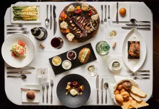 Plates line the table at the Chop House at Monarch Casino