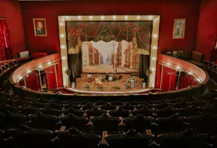 See the red-walled theater inside of historical Tabor Opera House in Leadville.