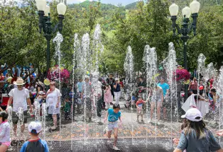 Dancing fountain with kids playing in it