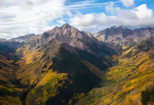 An aerial view of mountain peaks during the fall