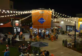 Bustling outdoor eating area at night