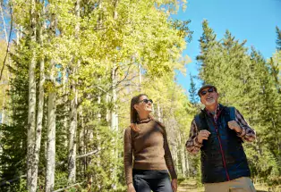 Couple hiking in the forest in Colorado