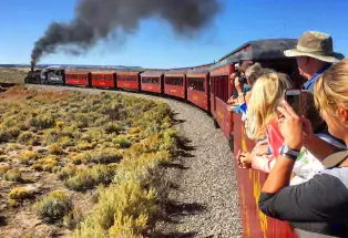 Train passengers viewing the surrounding landscape.