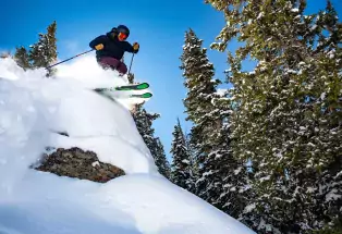 Skier gliding through powder