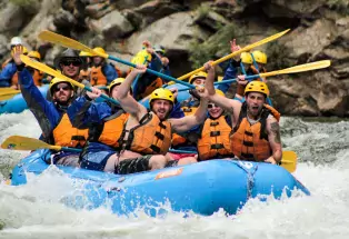 A group of people on a whitewater raft on Clear Creek near Idaho Springs, Colorado