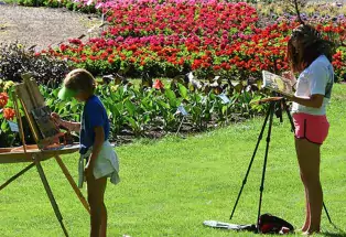 Two children flex their artistic muscles at Colorado State University's annual Flower Trial Garden in Fort Collins.