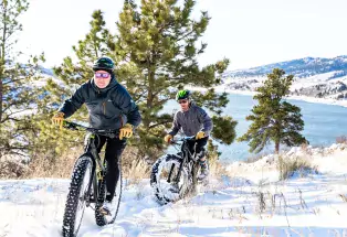 People Fat fire biking through fresh snow in Fort Collins, Colorado