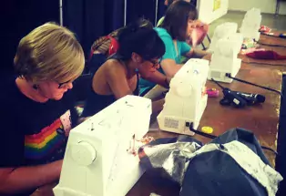 contestants competing at Denver County Fair's live sewing challenge