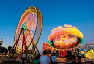 ferris wheels and rides at the colorado state fair in Pueblo, CO
