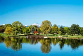 Bridge and mountain views in Loomiller Park in Longmont