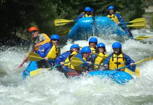 A group of people whitewater rafting with Colorado Adventure Center guides