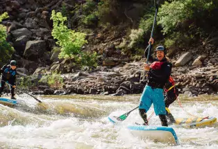 Stand-up paddleboarding on the river