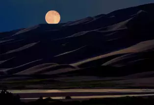 The moon over Great Sand Dunes