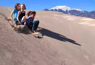 Sand sledding at Great Sand Dunes National Park and Preserve