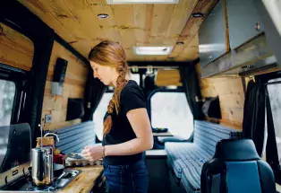 Breakfast on the road in an Aspen Custom Vans campervan