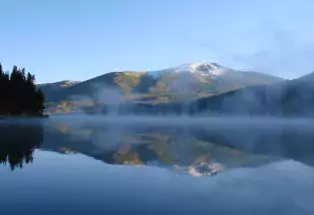 Still lake with the reflection of a mountain