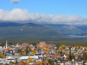 Bird's-eye view of Leadville in autumn Bird's-eye view of Leadville in autumn with mountains, fluffy white clouds and blue sky overhead.
