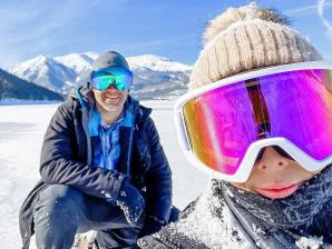 A snowshoe selfie near Leadville. Photo credit: @freightleadville Couple pauses for a snowshoe selfie near Leadville with mountains in the background.