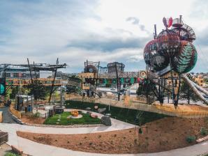 Children's Museum of Denver at Marsico Campus Aerial swings, giant cocoons, swinging walkways and other equipment in a park outside the museum